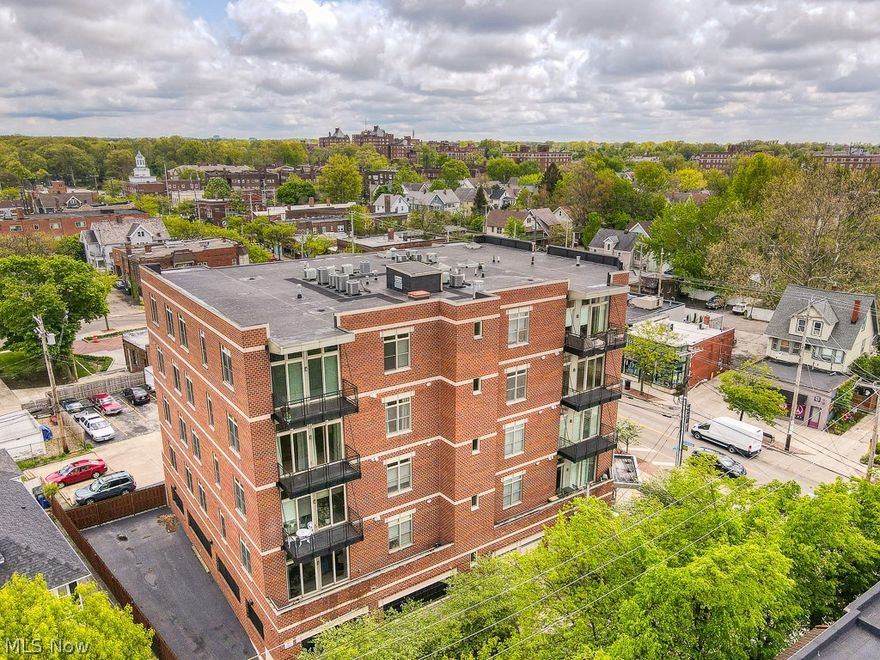 Beautiful and Unique 4th floor - 3 Bedroom condo in boutique, quality constructed condo building with elevator!  Located in the center of the vibrant and fun Larchmere neighborhood!  Walk or bike to shops and restaurants, as well as the Shaker Rapid, Shaker Lakes, and Shaker Square.  Located a short commute to University Circle, CWRU, University Hospitals, and the Cleveland Clinic.  Features  10 ft ceilings throughout, a huge Master Bedroom (17’3”x 11’8”) and Great Room (35’9 x 16’6), Gas Fireplace, Granite Kitchen with Stainless Steel Appliances and Euro Cabinets, Maple Flooring, 12x5 Balcony with views of Larchmere neighborhood and City skyline! Enjoy a spacious master bath complete with a jetted whirlpool.  Condo features a third room which can be used as a bedroom, home office, gym, studio, etc.  HVAC, Hot Water,  W/D are 1 year old. Includes a tandem parking space that includes PARKING FOR 2 CARS.  Additional interior and exterior parking spaces may be available for purchase, incl
