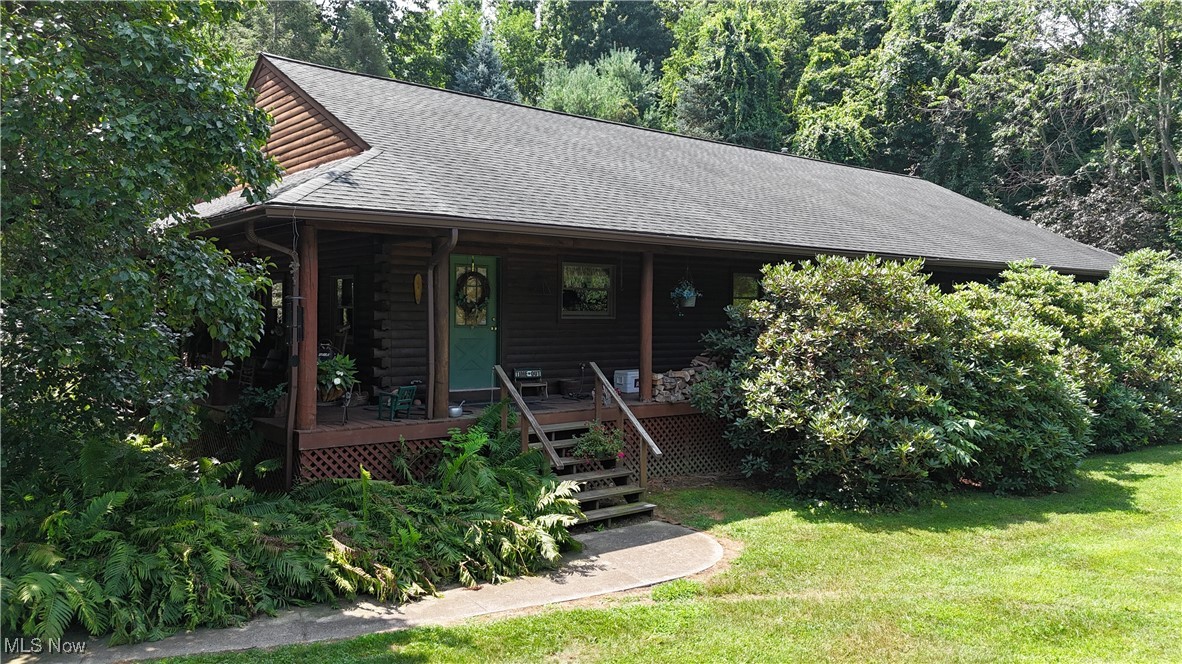 Take a look at this well maintained ranch log home with a full wrap-around covered porched situated on 2.24 scenic acres. This property features 3 bedroom, 2.5 bathrooms and an open concept kitchen and living room. The 29x12 flex space includes the laundry are and a 1/2 bath and could be used as an additional living room or office. Enjoy spending time outside sitting on the wrap-around porch, watching all of the local wildlife. The walk down crawlspace has a concrete floor and is a great option for your storage needs.
This home is secluded roughly 200 feet off the road. Please do not drive back the driveway without a scheduled appointment with a licensed Real Estate Agent.
This property is conveniently located just minutes from Rt. 2, Rt6 and the Ohio Turnpike ramps.
