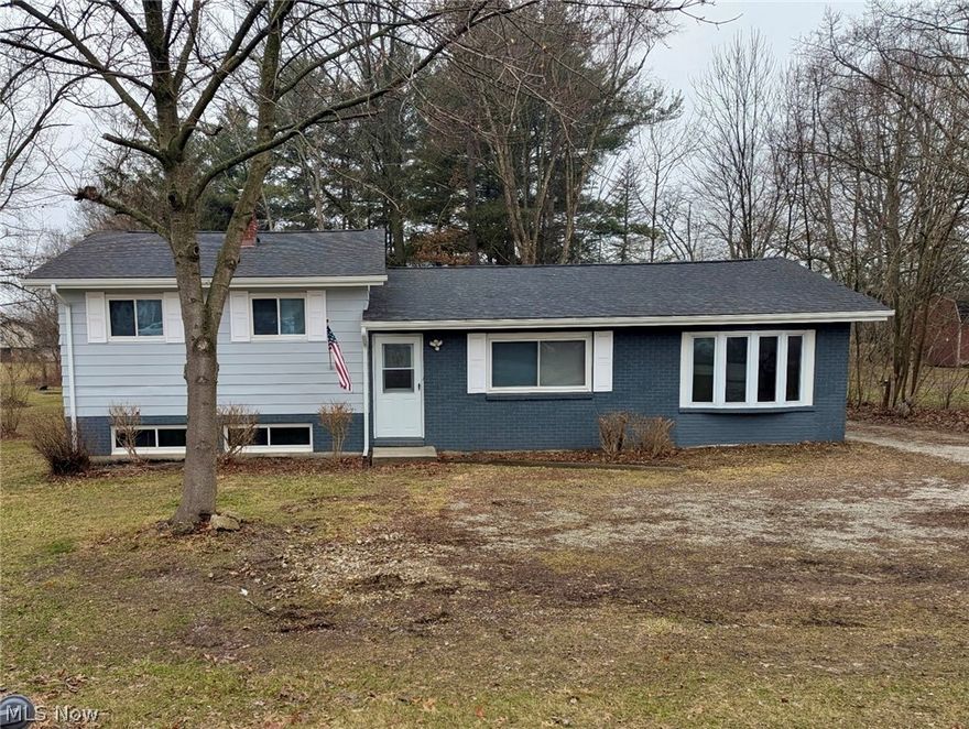 Residential home/office with commercial development opportunity! Spacious & updated 3 BR  tri-level split with open flow plan situated on two parcels. It located on the State Route 43 a mile from I-76. This 3-bedroom home features an open-flow foyer with a bay window that carries into the living room, highlighted by a charming vintage wood-burning fireplace. The updated kitchen opens to a four-season room with sliding glass doors, providing additional living space and natural light year-round. The lower level offers a comfortable rec room along with a utility/laundry area for added functionality. Recent updates include a new furnace, upgraded hot water tank, plumbing and electrical improvements, plus a new water softener and well pump, giving peace of mind to the next owner.  Located near downtown and a college campus with high traffic exposure, making it ideal for signage and visibility. Buyers to perform due diligence and verify permitted uses with the applicable zoning authority. Call today!