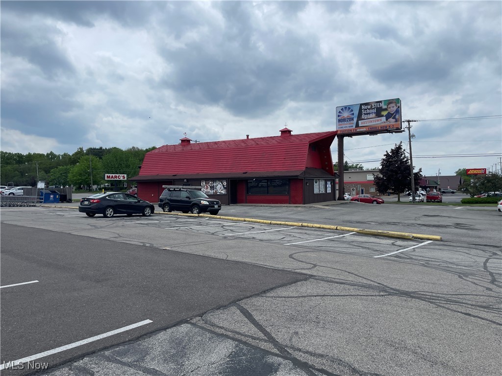 Corner location on busy Mahoning Ave in Austintown. Located at the signalized corner of Idaho Rd and Mahoning Ave with over 20,000 cars per day passing by. Currently operating as a restaurant with drive thru, but can accommodate a variety of retail as well. Hood with Ansul system is up to date. 3 bowl sink included. 2 ADA bathrooms. A billboard on the property provides additional income. Zoned B2 Business. This building is also being offered for lease.