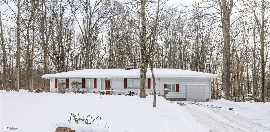 Cozy, well-maintained ranch on a serene .71-acre wooded lot! Move-in ready one-floor living with 1,446 sq. ft., 4 bedrooms (or 3 + office) and 1.5 baths. Bright, remodeled kitchen features white KraftMaid cabinetry, quartz countertops, walk-in pantry, newer appliances including commercial grade washer and dryer and LVP flooring that flows through most of the home. Enjoy a wood-burning fireplace, sunny 3-season porch, concrete patio, garden shed and attached 1-car garage. Recent updates include new LVP flooring, light and plumbing fixtures, blinds, bi-fold doors, closet motion lights and a newer hot water heater. Quiet, park-like country setting yet minutes to SR-14, SR-18, I-76, I-80 Turnpike, SR-224, SR-225, SR-183 and SR-5. Close to Kent State University, University of Akron, NEOMED, BIOMED, Southeast Schools and downtown Ravenna & Kent. Perfect for easy commuting and comfortable, single-level living. Schedule your showing today!