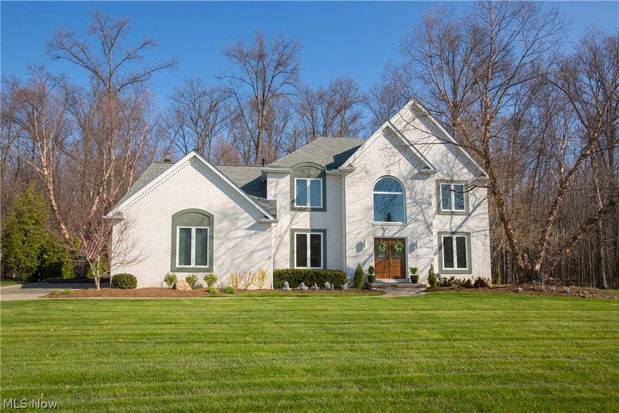 Prepare to be Moved!...into this sophisticated Westlake colonial.  From the moment you enter the double entry doors & step into the grand 2-story foyer, you’ll be amazed at each turn.  Crown molding, tray ceilings & chair rail accents lend elegance & architectural interest to the formal living and dining rooms.  French doors open to the office just off the foyer.  Gleaming hardwood floors flow from the foyer to the truly exceptional kitchen.  Cool granite, sparkling cabinets & sleek SS appliances all combine with today’s fixtures & finishes to create a one-of a kind space.  Palladium window & bay window/doors in the dining area provide abundant natural light.  The adjacent vaulted family room with cozy fireplace offers not just skylights but a wall of transom-topped windows overlooking the yard to continue the open, airy atmosphere.  The Master Suite is a peaceful & relaxing retreat with an exquisite spa-like bath with jetted tub, skylight & dual granite vanities.  Three additional bed