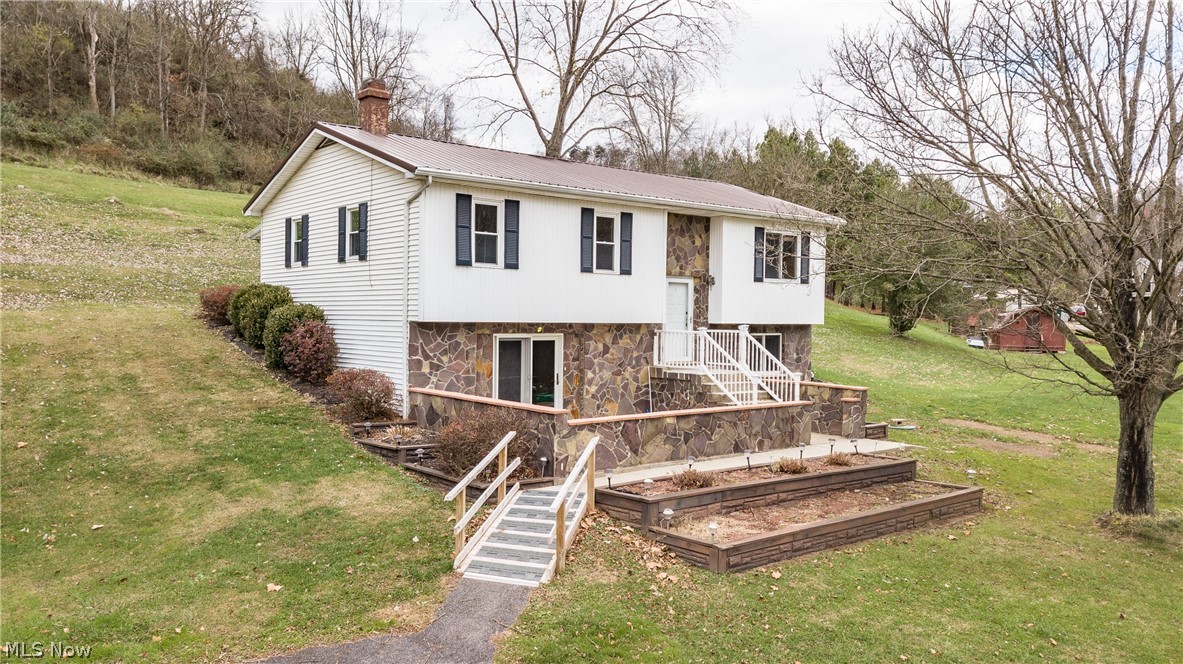 This home is much larger than it appears. There are 3 bedrooms on the main floor along with a supersized kitchen and dining room. There is an additional area off the dining room that could serve as a prep area. At the back of the home is a study perfect for relaxing with a wood stove. The downstairs has a large family room and Rec Room along with an office. Recently installed septic system and a metal roof. Situated on nearly 2 acres