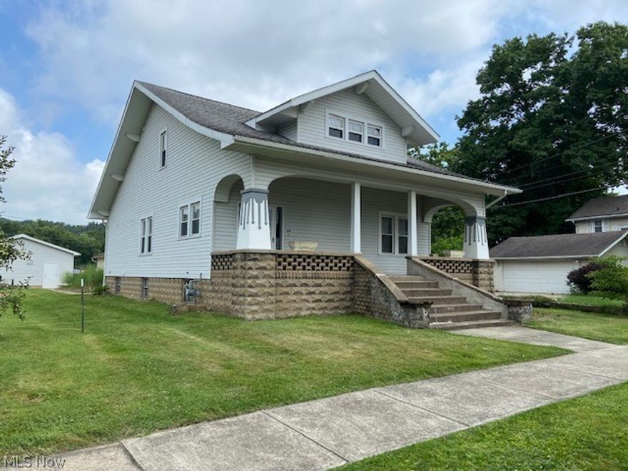As you walk up the dramatic front steps & enter the spacious foyer w/a walk-in coat closet, you will not believe your eyes. This home is one of the most unique in the area. 3,750 SF of grandeur. Beautiful woodwork, hardwood flrs, gas log FPL, exceptional dining room w/window seat. A custom kitchen that has incredible cabinets to the ceiling, 2 pantries as well as a full closet pantry in hallway, a breakfast bar, abundant Corian counter space, fully equipped w/appliances along w/a built-in that is cable ready. The 1st floor BD could also be used as a den. 1st flr laundry has cabinetry & half bath along w/washer & dryer. There are 2 BD's on the 2nd floor, brand new carpet (7/2021) & a full bath. BD's have large closets. A 27X18 bonus room w/two walls of cabinets & counter space, sink & walk-in closet/office could be converted to additional BD's. This home could also be easily duplexed. Enclosed back porch, nice deep walk-out bsmt. BONUS! 2-car block gar near house w/concrete pad. Addtl 2