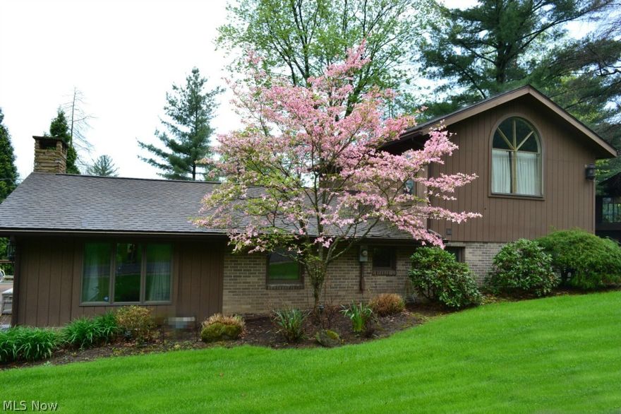 One of Atwood Lake's finest is waiting for your enjoyment!  Remodeled in 1991, this charming home offers 3 bedrooms, 2 on the main level and the Master Suite lofted above.  Two full baths, two gas fireplaces, gorgeous sunroom, and an enormous deck with a view of the lake.  The chef's kitchen offers a Viking six burner gas range, double ovens and wine cooler.  The living room is ready to entertain with beautiful vaulted ceilings, bar area, and open floor plan.  Furniture stays.  All of this AND you receive a four section boat dock, close to the marina!  This Atwood oasis brings the possibility of adventure or relaxation, depending upon your preference.  One thing is for sure, the memories made at 9208 Hillside NE will last a lifetime!  Welcome home!