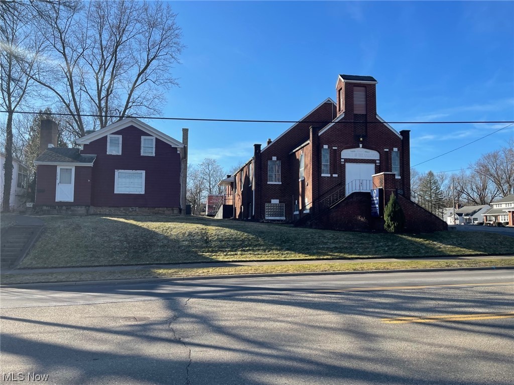 5,000 sf all brick church, house, recreation center and vacant lot located on 1.12 acre. Church capacity is approximately 150 people. There are two small storage rooms on either side of the nave. The downstairs has five classrooms, a spacious meeting room and restrooms. There is a wheelchair ramp into the church and the lower level is a walk out. Freestanding recreation center building that is approximately 1,000 sf. It has a wood burning fireplace, half bathroom and kitchen. Range and refrigerator stay. There is also a two-story, three bedroom home on the property. Washer and dryer stay. 45 parking spaces plus additional parking on the church's lot next to the church.