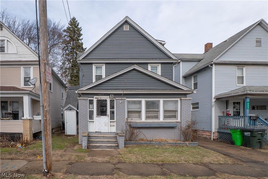 This spacious three-level Colonial offers flexibility, updates, and room to grow! Currently used as a single-family home, this 4-bedroom, 2-bath property also offers potential for a duplex setup with a separate side entrance to the upper level.

The main floor features updated laminate flooring, recessed lighting with dimmers, and a bright, open living room complete with ceiling fan and TV mount. The formal dining room includes a new sliding door leading to the fully fenced backyard—perfect for entertaining. The updated kitchen offers ample cabinetry, laminate flooring, and appliances that convey, including dishwasher, gas range, microwave, and refrigerator. A full bath on the main level showcases tile flooring, a tiled shower with glass doors, and a solid surface vanity.

Upstairs, you’ll find a second kitchen with laminate flooring and appliances, two bedrooms, and a full bath featuring tile floors, solid surface counters, a jetted tub, and even a Bluetooth speaker. The finished third floor provides two additional bedrooms with built-ins—ideal for extra living space, home office, or guest rooms.

Additional updates include newer windows on the second floor, newer roof (approx. 5 years old with new sheeting and 30-year shingles), new siding, updated PEX plumbing, updated electrical for the whole house with new meter and service from the pole, glass block basement windows, and a newer hot water tank. The unfinished basement includes laundry hookups.

Outside, enjoy a fenced backyard, enclosed front porch, patio area, detached 1-car garage off the alley, and additional carport parking.

A unique opportunity offering space, versatility with updates—schedule your showing today!