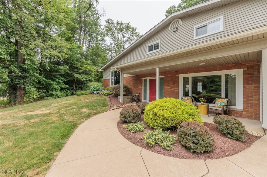 Wow!!  Do not miss this opportunity to own this unique, certainly one of a kind, Tallmadge split level on over an acre.  This 4 bedroom, 2.5 bath split level has over 2500 square feet.  A huge family room is at the main level at the ground, and features an awesome wood burning fireplace, half bath, and access to the deck.  The main level features an updated kitchen, large dining room, a large formal living room with vaulted ceilings... and an amazing 26x19' master suite with a  12x8 walk-in closet and 12x12 bathroom.  The master bath has a double stand up shower, double sinks, a garden tub, and ceramic floors.  The upper level has 3 good sized bedrooms and a nice bathroom.  The lowest level is huge, with a workshop, high ceilings, carpeted, cabinets, a 200 amp electric panel, and more.  The attached garage is a monster at 31x27, and also has a big carport off of the side.  The wooded acre features a giant natural wood deck, shed, and wonderful landscape.  There is believed to be natural wood floors under most of the upper carpet.