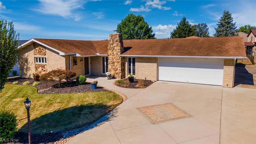 Discover this beautifully updated ranch home located in the desirable, Rolling Acres neighborhood, just minutes from Wintersville, Steubenville, Weirton, and only 45 minutes from Pittsburgh. Don’t be deceived by the exterior SIZE, this property offers expansive living areas perfect for family time or hosting friends during holidays and gatherings. With 4 bedrooms, 3 full bathrooms, and over 2,700 sq. ft. of finished living space, this property blends comfort, function, and modern updates. Spacious living room with wood-burning fireplace, open to the dining area. Remodeled kitchen (2020) featuring custom cabinetry with soft-close pull-outs, granite countertops, coffee/wine bar station, three large pantry cabinets, and SmartCore waterproof flooring. Engineered bamboo flooring throughout the living areas and bedroom. Owner’s suite with private bath. Oversized sliding glass door opening to the patio and covered breezeway, perfect for indoor/outdoor entertaining. Lower Level (Finished in 2025) Large family room with mounted 75” TV. Custom-built bar with white oak base, butcher block top, and wormy maple tongue-and-groove ceiling. Full bath and oversized laundry room with butcher block counters, deep sink, and sump pump. Spacious 4th bedroom with barn doors and walk-in closet. Outdoor Features Two-car garage plus a 1.5-car workshop/garage with 100-amp service, connected by breezeway. Concrete driveway, sidewalks (2019), breezeway, patio (2022), Putting green & water feature (2025), Covered breezeway with skylights, fans, TVs, and entertainment space. Fire pit and beautifully landscaped yard. Doctor Energy Certified (2023) new insulation, Air Gaped, & new Baffles installed, ventilation improvements, air gapping, and energy-efficient updates, 200-amp electrical service in main home, Anderson windows throughout with all East & West facing windows tinted with clear ceramic tint, Central air and gas furnace. Located just outside city limits.