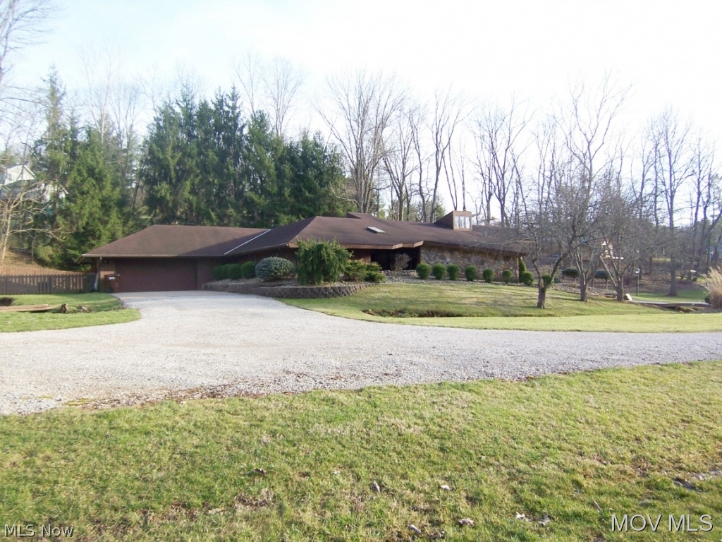 Unique contemporary home situated on a beautiful, private 1.59 acre lot within city limits. Over sized kitchen with solid surface tops with Inlay, dining room with a stone wall and built in hutch plus private patio off kitchen for dining & relaxing. Living room features "see thru" stone fireplace, hardwood floors and floor to ceiling windows. Master bedroom suite offers large double closets, fireplace plus spacious Master bedroom bath with plenty of cabinets, garden tub & double shower plus makeup area. Elem: Putnam Elementary School Elem/Bus: Y JrHigh: Marietta Middle School School JrHigh/Bus: Y High: Marietta High School High/Bus: N Fire: CIT Police: CTY PossFreeGas: N ;SQFT=Fin L1:3160, Fin Above:3160, Fin Total:3160, Unfin Above:0;GAR= 2 Car Att, Opener(s)