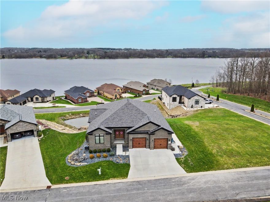 Absolutely phenomenal five-bedroom, four-and-a-half-bath home overlooking the breathtaking Pine Lake Reserve.

The main level showcases a massive open-concept great room with soaring cathedral ceilings, seamlessly flowing into the eat-in kitchen. This stunning space features a large center island, breakfast area, quartz countertops, upgraded stainless steel appliances, and a spacious pantry—perfect for both everyday living and entertaining. A convenient half bath and generously sized laundry room complete the first floor.

The luxurious master suite offers a wall of windows facing the lake view with private access to the covered back deck, which is also accessible from the great room. The en-suite bath includes a linen closet, expansive walk-in closet with custom built-ins, soaking tub, floor-to-ceiling tiled walk-in shower with dual shower heads, double vanity with marble countertops, and a private water closet. Two additional bedrooms and a full bath round out the main level.

The fully finished lower level provides exceptional additional living space, featuring two large bedrooms and two full baths. One bedroom is an expansive suite with a massive walk-in closet and scenic lake views, along with a beautifully appointed bath offering a large walk-in tiled shower and double sinks. The fifth bedroom, currently used as an exercise room, includes its own private bath with a floor-to-ceiling tiled shower.

A spacious family room with sliding glass doors leads to the covered patio, complete with a full second kitchen—ideal for entertaining or multi-generational living.

This home offers luxury, space, and incredible views in one truly remarkable setting.