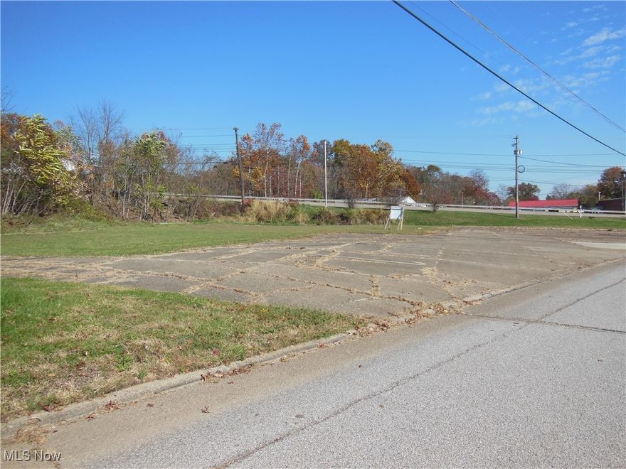 Commercial lot in a high traffic area, South Parkersburg.  Highly visible location at the junction of Pike Street and Broadway Avenue Extension.  All utilities available; there was previously a large commercial building on this property that has been removed. The lot consists of two parcels; the second parcel is just a small triangle on the Southwest corner of the property. A very small piece of the property has been acquired by the state for a future roundabout. Per Owner: “Pending roundabout placement with access.  No additional property purchases planned by the roundabout project as per project engineer’s verbal.”