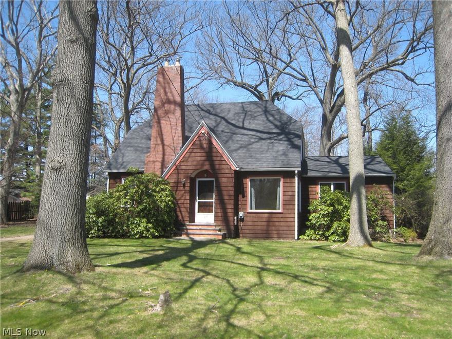 This is a 4 bedroom 2 full bath cape on a private street. The lot is 1.02 acres. There is a 2 car garage a with a workshop area. The master bedroom is on the main level and has a full bath. The master bedroom also has a sliding door to the deck. The large living room has a bright picture window, hardwood floors and wood burning fireplace. The eat in kitchen has ceramic tile and newer cabinets. There are 2 bedrooms upstairs and a full bath. The roof is new as of April 2016. The home has a well and septic. The water and sewer are at the end of the driveway.