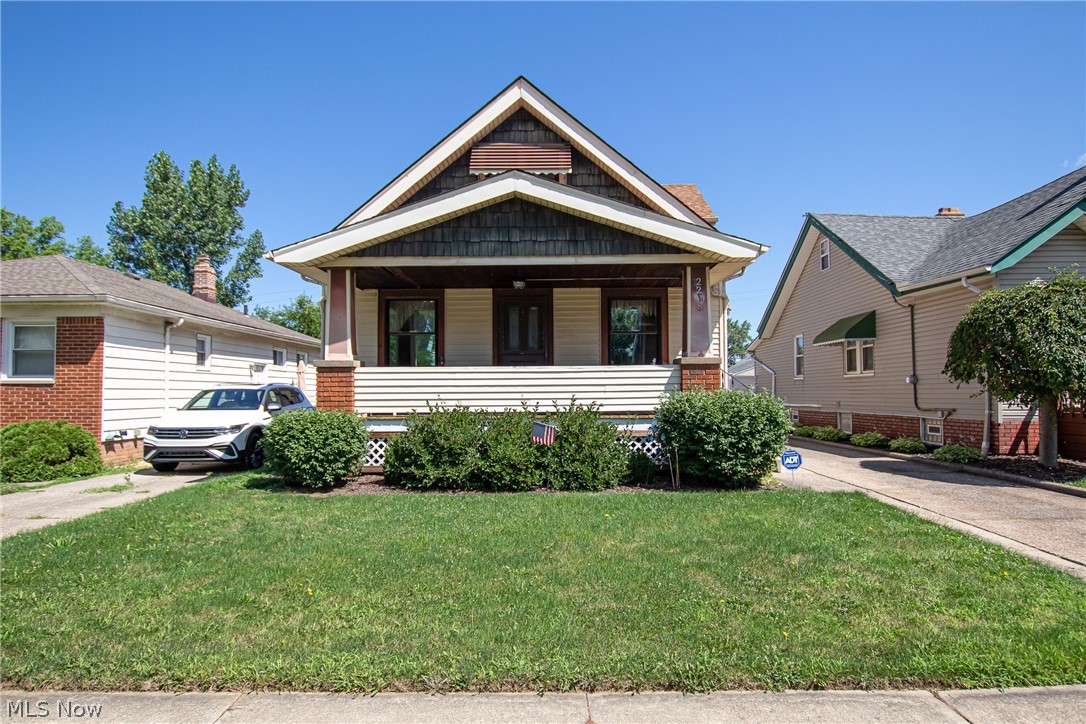 This Parma Bungalow offers 1,620 sq ft of living space and features 4 bedrooms and 1 full bath. Upon approaching the home you are greeted with a large covered front porch perfect for relaxing in the evenings on a porch swing. Once inside the home, notice the lovely arched entryways and crown molding in the living and dining room. There are original hardwood floors in the living and dining rooms plus in the hallway, and both bedrooms just waiting to be uncovered. The formal dining room off the kitchen features a lovely built-in china cabinet with lead glass doors, storage space, and a window seat. The eat-in kitchen offers ample counter space and cabinets and an additional dining area. Off the eat-in area is the family room with access to the fenced backyard and an oversized two-car detached garage that has additional storage space. Completing the first floor are two bedrooms and a full bath. Upstairs is completely finished with knotty pine walls and offers two additional bedrooms