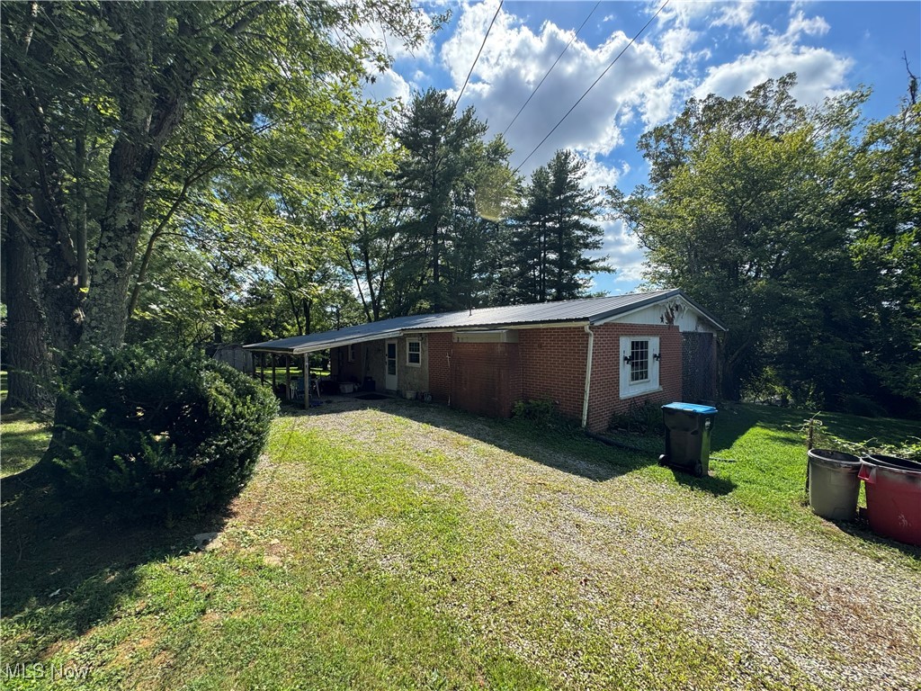 Discover an investors or visionaries dream in the heart of Zanesville. This 3-bedroom, 1-bath ranch home offers nearly 1,300 sq. ft. of living space and just under 3 Acres of total land, this home has endless upside. This property features a functional layout, basement space with wood burner and both garage and carport parking—ideal for either a rental property or a future renovation project for a forever home. The possibilities are endless.