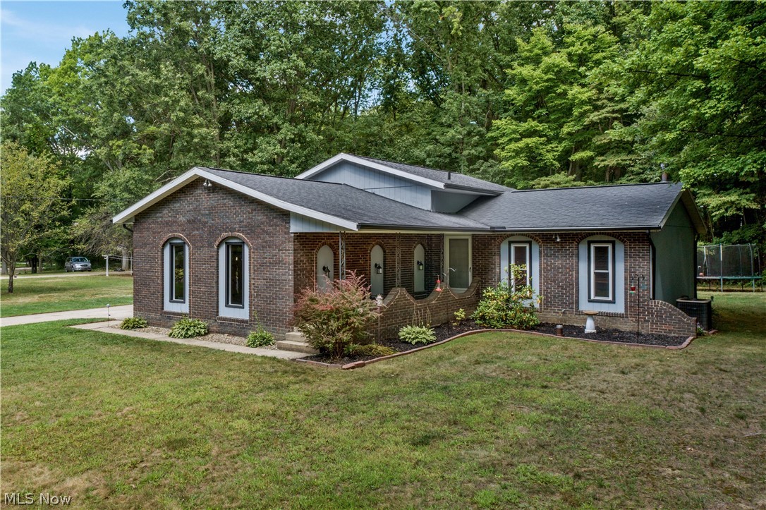 Located in Green LSD, this home offers so much more than it appears from outside! With almost 1700 sq/ft of above ground living space, 4 bedrooms, 2 full bathrooms, family room, living room, basement (unfinished, very clean), almost 3/4 acre of land, there is plenty of space here for your needs/wants! Once inside you will notice the beautiful beamed ceilings, the bright and inviting dining area and kitchen with updated granite countertops, the open and functional floorplan, new carpeting and paint in bedrooms, and updated bathrooms. Many updates throughout!
Projector in the family room stays with the home! Waterproofed basement with lifetime warranty! Seller is also including a 1 year home warranty!