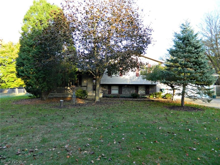 Enter through the covered front porch in to the Spacious 3-4 Bedroom split level home in a great condition.  The main floor has an open concept with the living room, dining room, and sliding glass doors to a large 3 seasons Florida room.  The upper level of the home has 3 bedrooms and a full bath.  The lower level features a family room, 4th bedroom or office, and 2nd full bathroom.  And there is also a 4th level with basement storage space and laundry room.  The outside is a great place to entertain with a fenced in yard, heated pool, and 3-tiered deck off of the Florida room all situated on over an acre lot.  2 car attached garage.  And a great location- conveniently located with easy access to freeways and major cities like Cleveland and Pittsburgh.  Home Warranty is included for a worry-free purchase!  Call today to schedule a private showing!