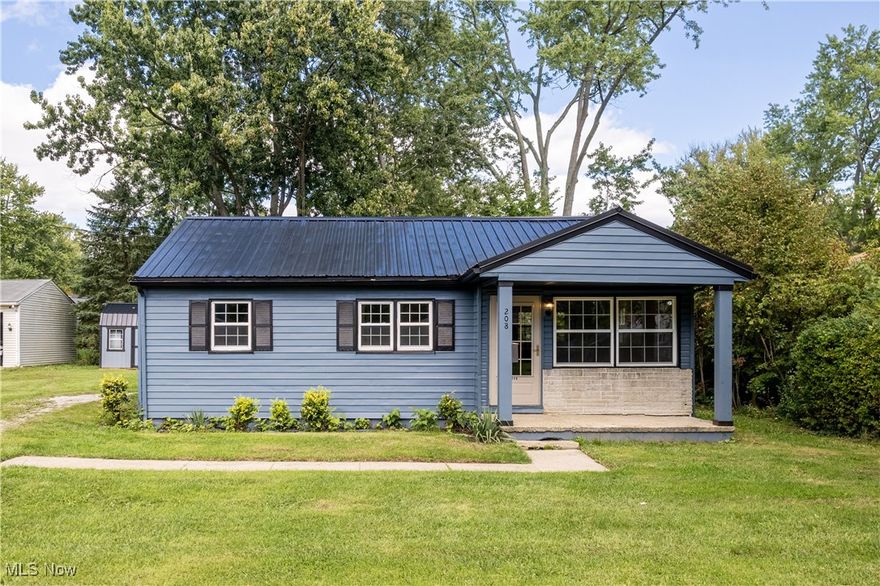 Situated on an extra large city lot, this charming ranch style home nestled in the heart of Wadsworth is awaiting its new owner! Refreshed, revamped, and ready to go, this 2 bedroom/1 bathroom home offers the convenience of single story living and the opportunity to immerse yourself in nature right outside your back door. After enjoying the spacious covered front porch, step inside, where you're greeted by wall to wall wood floors and tons of natural light. Countertop seating at the center island makes this space perfect for quick meals or entertaining guests. All kitchen appliances will remain. Wood floors continue down the hall, where you'll find two great sized bedrooms and full bathroom. Don't need two bedrooms? Use the additional space as a perfectly placed home office, craft room, or delightful guest bedroom! The first floor laundry room is conveniently tucked away behind the sliding barn door. Spend the upcoming autumn nights on the expansive rear deck, complete with covered seating area and views of the neighboring creek. The large storage shed makes storing your seasonal items a breeze! This home has many recent updates, including a newer shed (2023), most windows are newer, interior and exterior paint (2024), new metal roof (2024), newer electrical (2024), and some newer lighting (2024). Don't miss out on this gem—schedule your showing today and experience the charm that this home has to offer!