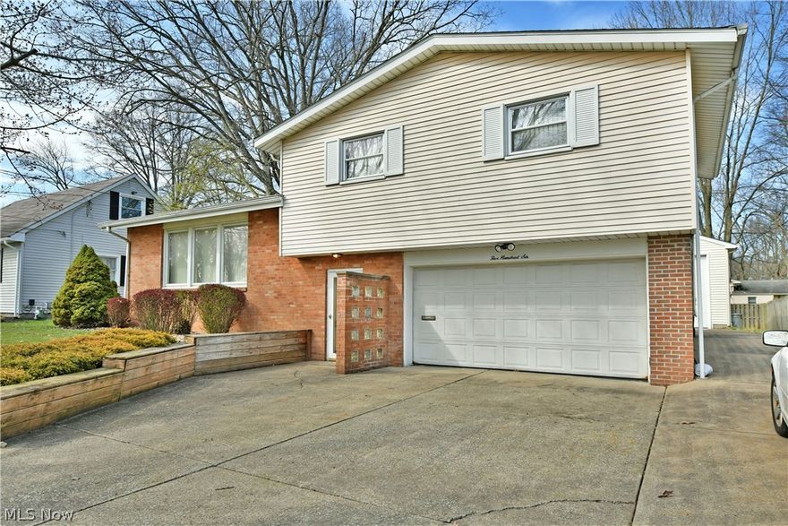 This fantastic Liberty home is car enthusiasts dream and is fresh on the market! As you approach take note of the wide concrete drive providing ample parking. Head inside the home and take in the split level design. A long hall welcomes you and provide access to the attached garage and a convenient powder room. Up a short flight of stairs you will find a large living room with updated carpeting and tons of natural light. The dining room blends seamlessly with this space thanks to an open concept layout so meal time and entertaining are a breeze! The kitchen is hidden away but packs a serious punch with loads of cabinetry, prep space and built in dining. Up to the next level you will find a full bath that joins with the main bedroom creating an ensuite feel. Two more amply sized bedrooms join the main and round out this level. Head down to the lower level and enjoy a second living area which can become a game room, teen hangout space, or whatever you can think up! This level is completed by laundry services, mechanicals and plenty of storage. The back of this home showcases a raised patio for outdoor relaxation as well as a detached heated garage with space for 4 vehicles! Some updates include Roof 2018, Rear Garage Roof 2023, Central Air 2014, newer carpet and paint. Call today for your personal tour!