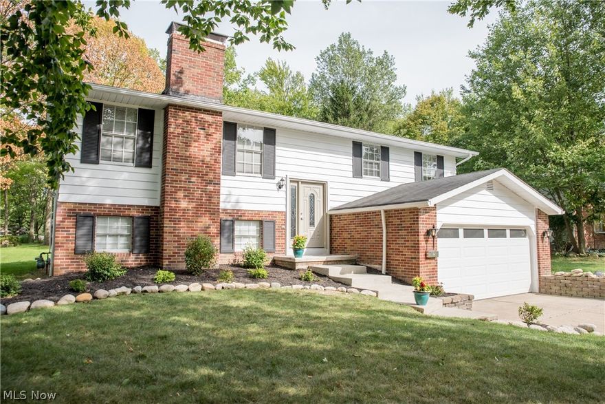 Welcome to this stunning and completely updated 4 bedroom, 2 full bath split level with nearly 2000 square feet and 2 car extended garage located in the Indian Creek neighborhood.  The remodeled eat-in kitchen features espresso cabinets, glass mosaic backsplash, granite countertops, breakfast bar and stainless appliances that stay!  Ceramic tile flooring throughout the kitchen and dining room.  Slider off the dining room leads to a 20x14 deck overlooking the spacious, treed backyard.  A living room with floor to ceiling stone fireplace, three bedrooms and fully renovated full bath complete the main/upper level.  The first/lower (above grade) level hosts a large family room with wood burning fireplace, 4th bedroom, second beautifully remodeled full bath with walk-in tiled shower, laundry room and garage access.  Additional updates include new carpeting, lighting, AC ('18), interior and exterior paint.  All you need to do is move in! Schedule your private showing before it's too late!