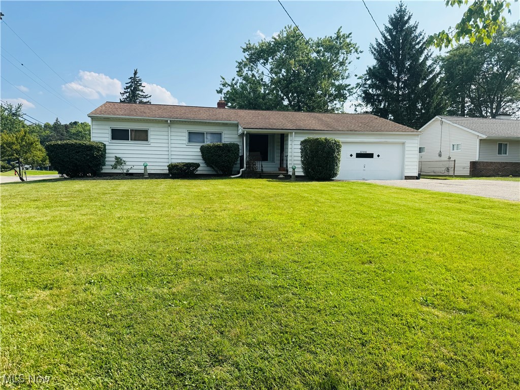 **Welcome to this charming ranch in Bedford Heights!** Convenient one-floor living with central air and hardwood floors throughout. This home features 3 spacious bedrooms with ceiling fans and ample closet space. A full bathroom and closets complete the hallway. The open concept in the living and dining rooms plus access to the deck is perfect for entertaining and spending time together. The eat-in kitchen offers additional dining space and a half bathroom just off of the kitchen completes the first floor. The full basement has been waterproofed with lots of potential for additional living space and additional storage. 100% insulated in 2017. Property sits on a quiet corner of a dead-end street, with an attached two-car garage plus driveway that fits 9 cars. Riding lawnmower stays with home to help cut over a quarter of an acre lot! Located near major shopping centers, dining, parks, and easy highway access. Point of Sale compliant, move-in ready! Schedule your tour today!