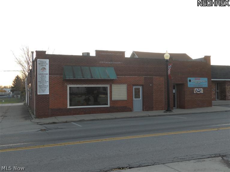 Located in the heart of Lagrange this commercial building could be used for a lot of different businesses. Over 4,500 SqFt and is currently set-up for an attorney & accountant's offices with a large open area that was last used as a gym/workout area. There are 4 baths! Heating and A/C systems have been updated. Roof was updated in 2011 with a warranty. Just 5 minutes to Route 10/480.