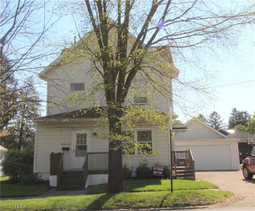This over 2400 sq ft home is currently a single family home but could easily be converted back to a duplex.  The first floor features a beautiful stair case and woodwork with living room, dining room, kitchen, bedroom, full bath and laundry.  The second floor has a living room, kitchen, laundry hookup in full bath, and three bedrooms. With a little elbow grease this home could be restored back to the home it once was or a great investment if made back into a duplex by adding a door and a wall. There are 2 water heaters and 2 furnaces and the electric is separated. Vinyl sided and with a deck off the back and a 2 car garage with opener.