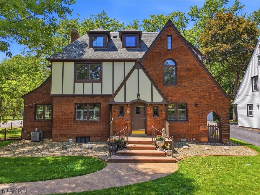 Situated on a picturesque corner lot, this stunning Tudor home seamlessly blends timeless elegance with modern updates throughout. Offering over 4,000 square feet across four finished levels, this one-of-a-kind property features five spacious bedrooms, five-and-a-half baths, gleaming hardwood floors, custom built-ins, and classic French doors that add warmth and character at every turn. The beautifully remodeled kitchen is a true chef’s dream, complete with abundant cabinetry, double ovens, stainless steel appliances, and an expansive dining area designed for gathering and entertaining. At the center of the home, the inviting living room showcases striking built-in bookcases, while the adjacent office or playroom is flooded with natural light from two walls of windows. Upstairs, the recently renovated owner’s suite offers a luxurious retreat with a spa-inspired bath featuring heated floors for year-round comfort. Three additional generously sized bedrooms, each with its own private full bath, provide exceptional comfort and privacy on the second floor. The third floor presents endless possibilities with a spacious open-concept living area, full bath, and ample storage—perfect for a guest suite, media room, studio, or hobby space. Additional updates include newer windows throughout with a lifetime warranty and a whole-home generator, ensuring comfort and peace of mind in every season. Step outside to enjoy beautifully landscaped grounds, a patio accented with charming Wooster paver bricks, and a screened-in gazebo ideal for relaxing evenings or entertaining guests. The detached three-car garage also offers additional upper-level space perfect for an art studio, workshop, or extra storage. More than just a beautiful property, this home offers exceptional space, comfort, and character—because it’s not just a home, it’s a lifestyle. This remarkable residence is ready to welcome its next chapter. Schedule your private showing today!