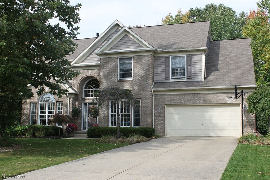 Open, bright and updated is this 4 bedroom, 2 ½ bath Twinsburg home on a quiet Cul-De-Sac in Ethan’s Green located on a beautiful wooded private lot that backs to Gleneagles golf course.  Dramatic 2 story foyer with spiral staircase opens to the living/dining room with arch details and tray ceiling.  The huge updated kitchen includes all stainless steel appliances and tons of cabinets with walk in pantry which opens to the soaring 2 story great room with gas fireplace.  A first floor office and laundry room complete the first floor.  Relax in the vaulted master suite or soak in the oversized tub in the spacious master bathroom.  Plenty of space in the walk in closets and 3 other bedrooms upstairs.  The finished lower level is perfect for movie night or a play room.  Enjoy dining al fresco on the brick patio with peaceful water feature and lush greenery.  Highly rated Twinsburg City schools, minutes to 480, 422 & Route 8, and less than a mile to Heinen’s grocery store.  Twinsburg city a