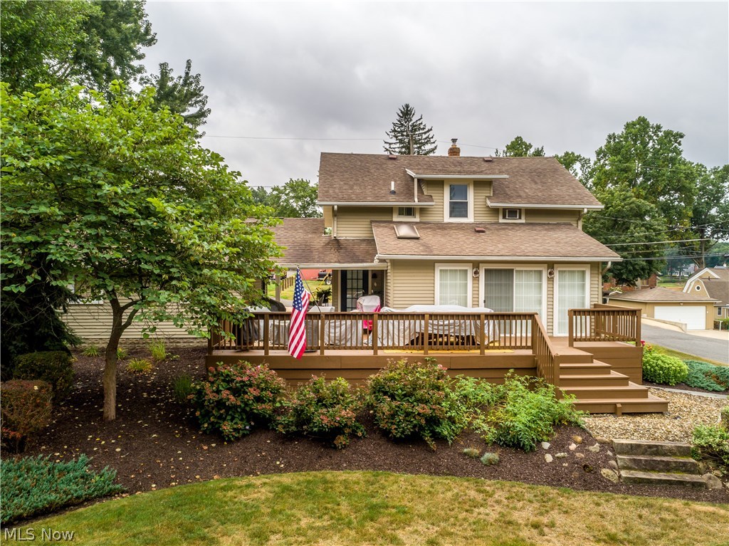 Stunning 3 bedroom/1.5 bath colonial in the heart of Portage Lakes with 1544SF, unfinished basement & 2 car garage on landscaped corner lot with water views* Modernized, yet charming, starting with living room with wood floor & crown molding* Formal dining with wood floor, crown molding & French door to 4 season sunroom with access to deck* Vaulted 4 season sunroom with window wall, slider to deck & track lighting* Light & bright updated kitchen with white cabinets, granite, subway tile, stainless dishwasher (new) & frig (3 yrs.), range, microwave & wood like laminate floor* Remodeled half bath on 1st floor* 2nd level master with wood floor, 2 guest bedrooms, 4th bedroom converted to closet & adorable remodeled bath with tiled tub/shower, double vanity with vessel sinks & checkered floor* Wonderful open vaulted breezeway between house & garage* Large deck connected to breezeway* Remodeled from studs in- drywall, wiring, plumbing, windows, wood trim & shingles- single layer, approx. 10