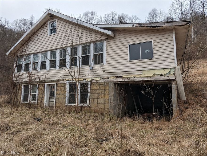 Looking for a CRAPPY CHEAP HOUSE WITH A VIEW??? Look no further!!!!We have what you are looking to own. You have the option of trying to remodel or leveling the existing structure with a bulldozer for a GREAT HOUSE SITE!!!  This 1.16 ACRES OVERLOOKING the LITTLE KANAWHA RIVER has the utilities in place with public water, gas, electric. Phone and internet available it has a fire hydrant close by to reduce the cost of insurance. SOLD AS IS WHERE IS.