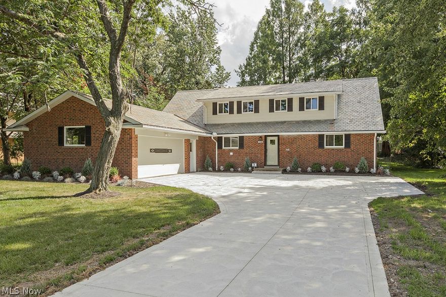 Professional and complete renovation by a member of the Shaker Renovator Program, developed by the City to acknowledge high quality workmanship. This house has it all! Private first floor master suite with private bathroom with poplar wood double sink vanity and travertine tile shower and flooring. Spacious kitchen with high-end appliances, custom cherry cabinetry with under-cabinet lighting, granite countertops, slate stone backsplash and travertine stone floor. Open living and dining room layout with hand-laid ledgestone fireplace with custom wood mantel and travertine tile hearth. First floor laundry with cherry custom cabinets, hide-away ironing board, mudroom bench and GE Right Heights front-load washer and dryer. New first floor powder room added. Additional first floor room can be used as office, den, or a Family Room.  Second floor has four bedrooms and two full baths -- including one en-suite with quartzite stone tile flooring and shower. Private backyard with newly added stam