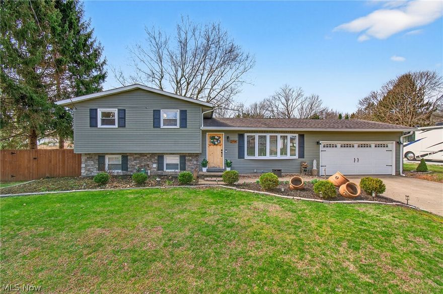 Welcome home to this beautifully updated four bedroom, two full bath home situated on a spacious nearly .70 acre lot in Plain Township, where thoughtful upgrades, functional design, and standout outdoor living come together!  As you enter, you're greeted with the spacious light filled living room. The open concept showcases the stunning kitchen - complete with quartz counters, stainless steel appliances & premium fixtures! The stylish center island is the perfect place for entertaining or everyday living with an adjoining dining space that flows seamlessly, making large gatherings effortless! The layout offers 4 generously sized bedrooms each with ample closet space and two updated full baths. The backyard is an exceptional outdoor living setup! The expansive 46’ x 12’ elevated deck is designed for entertaining and everyday enjoyment! Just off the deck you'll find the covered patio area, complete with a large freestanding fireplace & hot tub - making this outdoor space enjoyable all year around! The property also offers incredible versatility, with both a heated attached garage and a detached garage! What truly sets this home apart is the extensive investment in major systems, giving buyers peace of mind for years to come! In the past 5 years, the home underwent a full mechanical upgrade including the furnace, central air, hot water tank, and a water filtration system! In 2023, the electrical system was professionally upgraded to be fully generator-ready. A Predator 9000W gas-powered portable generator is also available, offering true preparedness and convenience!  Centrally located near parks, schools, dining and more - this is one you will want to see in person! Call today to schedule your tour!