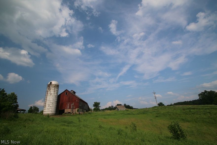 169.849 Acres for sale in Spencer Twp, Guernsey County on the outskirts of the small town of Cumberland. Here is your chance to purchase a nice farm in the rolling hills of Eastern Ohio! This property has almost a mile of road frontage along St Rt 146 (Bluebell Rd) and Iowa Rd. There is an older home on this property that's in great shape and has been recently used as a rental. The home has 3 bedrooms and a recently built full bath and laundry room addition. Next to the home is a large barn built in 1898 and several outbuildings. Over 50 acres of the land has been used for grain crops in previous years. Currently, the majority of the acreage is being used to grow hay. Looking to raise livestock? Most of this farm has fencing that would need just minor repairs. There are two large ponds on this property that are full of fish. Buffalo Fork Creek also runs right thru this property. The hunting potential here is awesome! You could set this property up many different ways to attract lots of