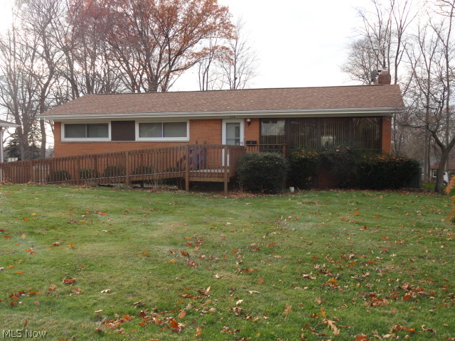 This Brick Ranch with a walkout lower level is situated on an extra deep fenced lot in an area of well maintained homes. 2 Bedroom 2 Bath, originally a 3 Bedroom could easily be converted back. It's Handicap Accessible if needed. Formal Living room and Dining room with Hardwood Floors. Charming Kitchen with plenty of Wood Cabinets, opens to the Family room with Gas Fireplace. 18 x 15 4-Season Sun room overlooks Big Back Yard. Lower Level Rec Room with Gas Fireplace plus Utility room. Two car Attached Garage. Updated roof, siding, furnace, central air and water heater. Cover Patio too!