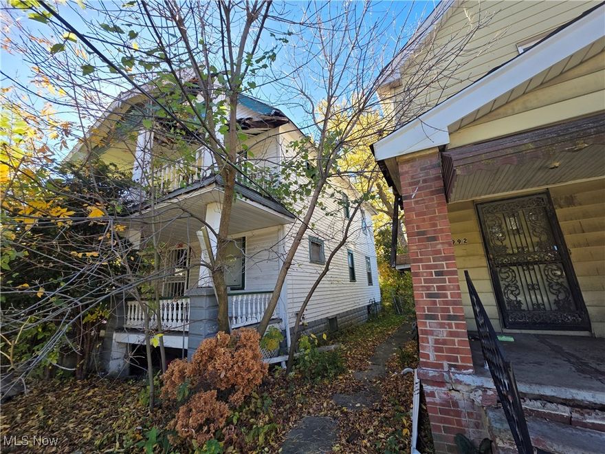 Charming opportunity for investors or rehab enthusiasts in this large two-family century home with classic front porches and tall ceilings throughout. This property offers generous room sizes, original built-ins, and a traditional dining room with wall cabinetry just waiting to be restored to its former character. Exterior features include multiple balconies, 2 car detached garage, and a deep, tree-lined lot that provides plenty of privacy and shade in a convenient city location. Home is being SOLD AS-IS and will require complete clean-out and renovation, giving the next owner a great value-add project with strong upside potential.