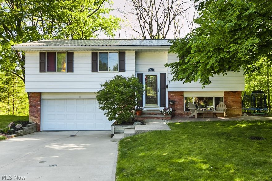 **THIS IS BEDFORD'S BEST KEPT SECRET**  This home backs up to a wooded area for the ultimate privacy.  This cul-de-sac street is next to Bedford Reservation and only 0.5 miles from Tinker's Creek.  This home has a metal roof (2007 ) that will last approximately 40 years! The gutters and gutter guards are 2014 and brand new ice guards were installed in 2015.  The kitchen had a complete remodel (2012) with hand-crafted 100% hickory cabinets and oak flooring added.  Attic storage was added by the current owner that runs the entire length of the home with a pull-down ladder for easy access.  **THIS HOME IS A BILEVEL.  IT HAS A ROOM JUST LIKE A BASEMENT, only there is way better natural light.  BEAUTIFULLY MAINTAINED in the most PEACEFUL SETTING!