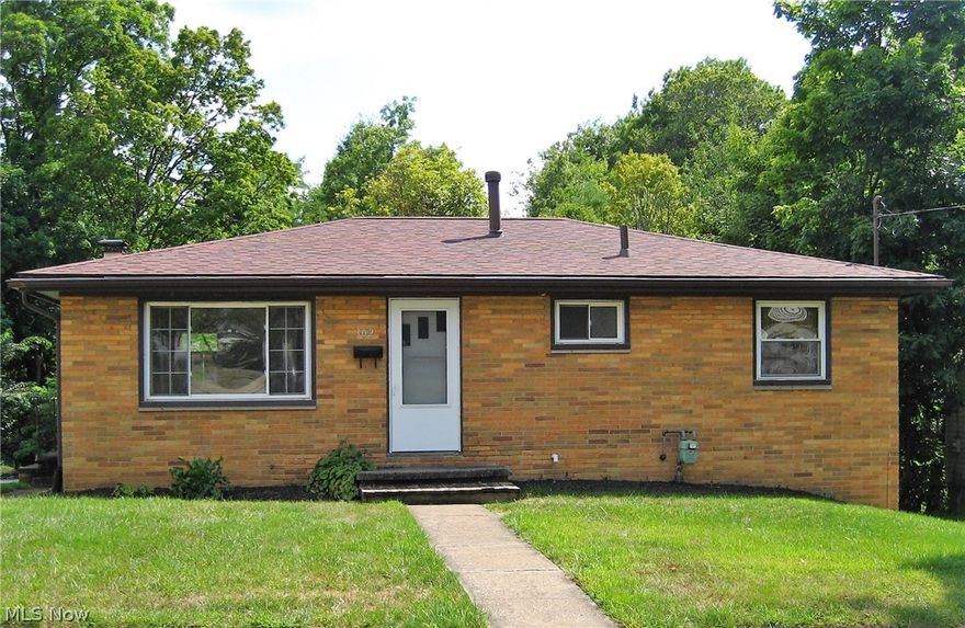 Conveniently located right around the corner from the city schools campus is this 3 bedroom brick ranch. Updates include: new carpet, waterproofing (2020), roof (2019), remodeled bathroom, high efficiency furnace, electric panel, replacement windows, some exterior doors. Hardwood floors in the bedrooms & under the living room/hallway carpeting. Basement is semi-finished with fireplace (never used) and walk-out to patio area.