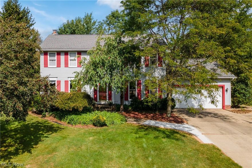 Welcome to this lovely 4 bed/3 bath colonial located in the desirable Green Local School District.  On the main level, the nicely sized living room opens to the large, fireplaced family room with a gorgeous bay window overlooking the fabulous lot.  Also located on the main level is the large, fully applianced eat-in kitchen with sliders leading to the private deck (equipped with a 220 line if needed), dining room for formal dinners and a 1/2 bath.  Upstairs you will find the sizeable owner's suite, along with 3 more bedrooms and another full bath.  The basement is partially finished with a nice rec room and ample storage.  Don't forget about the 2 car attached garage, shed and that spacious lot!  The lot stretches behind the home and is almost .7 acres.  Stop looking and start packing!  This is the one.  Call to schedule a showing today!