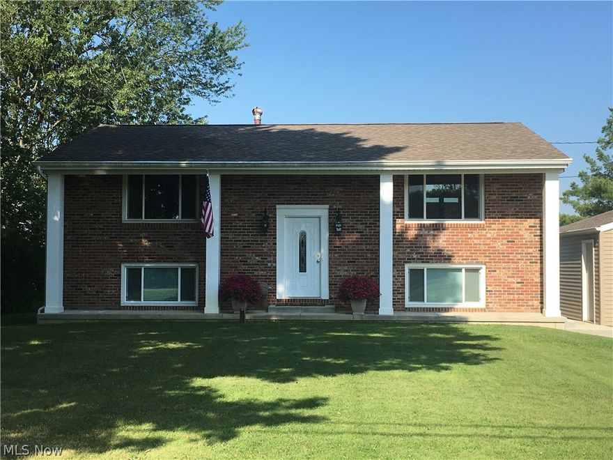 Peaceful country location with this "better than new construction" 4 bedroom, 2 full bath family home on .688 acre Marlington Schools.  Completely remodeled throughout, modern decor, neutral walls, easy-care laminate flooring in the open design living/dining/kitchen area. Ceramic tile in foyer, baths, and large laundry room.  Craftsmen kitchen cabinets with soft close drawers, pantry pullouts, new appliances, spacious granite counter tops, under and over lighting plus recessed lighting. Beautiful wall tiles in kitchen and baths, knock-down textured ceilings, lots of natural light, vinyl siding and windows, gas heat, 200 amp electrical panel, two bedrooms have double closets and closet organizers, sturdy exterior and interior doors, brand new long concrete drive with turn-around, 1 layer 4 year old roof on home and garage, level 100' x 300' lot just 1.5 mile to Rt 62, surrounded by other beautiful homes.  Upper deck off kitchen area to enjoy the beautiful evening sunsets. One-year home