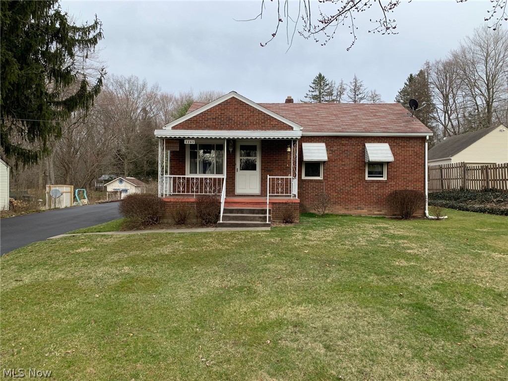 Well maintained, all-brick ranch on a large lot within walking distance of Mill Creek Park. The long, paved driveway with turn-around, guides you past the welcoming front porch to the detached 2-car garage and relaxing back patio area. Inside, you will be pleased by the spacious living room, dining room w/ built-in, multiple closets and hardwood floors (under carpets as well). The beautiful hardwoods continue through the two spacious bedrooms, both with ample closet space. A full bath and fully equipped kitchen complete the first floor. The partially finished basement has an oversized rec-room with nature stone flooring, a laundry area and a full bathroom as well as glass block windows. Updates include vinyl replacement windows throughout, new back entry doors, and fresh cement on driveway turn-around. Call today for your private showing!