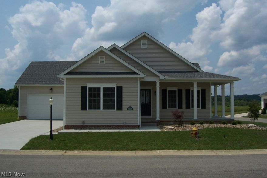 Beautiful 3 bedroom, 2 bath villa in The Lakes at Sharrott Hill.  Covered, wraparound porch with etched glass front door leads to great room with dark hardwood flooring, ceiling fan and lovely gas fireplace with mantel.  9' ceilings throughout.  Open kitchen features maple cabinets, large island for entertaining, neutral granite tops, pantry closet and stainless steel appliances.  Gorgeous ceramic tile continues through to dining area and sunny four season room with French doors to outdoor patio!  Pella windows.  Relax in your master retreat with decorative tray ceiling, large walk-in closet and glamour bath with dual vanities, Moen faucets and tiled shower with glass surround and door. Two additional bedrooms in front with full bath.  Closets galore.  Laundry room spacious and includes maple cabinets and sink. Two car garage is extra deep.  13 course basement is roughed in for future bath with high efficiency furnace and glass block windows.  12 month Builder Warranty!
