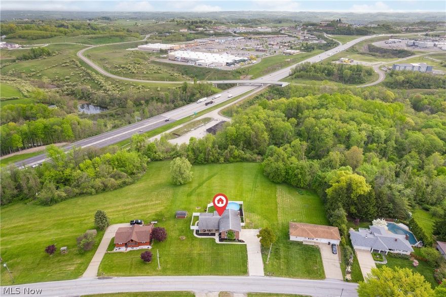 Welcome home to 67541 Willow Grove Road in Saint Clairsville. This spacious split level has much to offer. The property includes roughly 2900 square feet, 5 bedrooms, 3.5 bathrooms, an in-law suite, all on 1.71 acres. The first floor includes large living room with tons of natural lighting, ample dining room, cozy sunroom and generous sized kitchen. The upper level boasts the master suite along with two additional bedrooms that share a full bath. Lower tier offers additional in-law suite which includes family room with wood burning fireplace, kitchen, bedroom and full bath with it's own entrance. There's more! The basement includes tons of storage space and there is a walk-out to the backyard. The exterior features have much to offer, includes fenced in backyard, above ground pool and patio space. The front porch includes additional outdoor space. The updates are extensive: fence (2021), HWT (2022), windows (2023), flooring (2019), sidewalk & driveway (2020), master bathroom (2023), kitchen backsplash & disposal (2021), retaining wall (2023), paint throughout (2024), light fixtures (2022), pool (2023), and hot tub (2019). This property is truly a beauty and awaiting its new owner! Call/text for your private showing today!