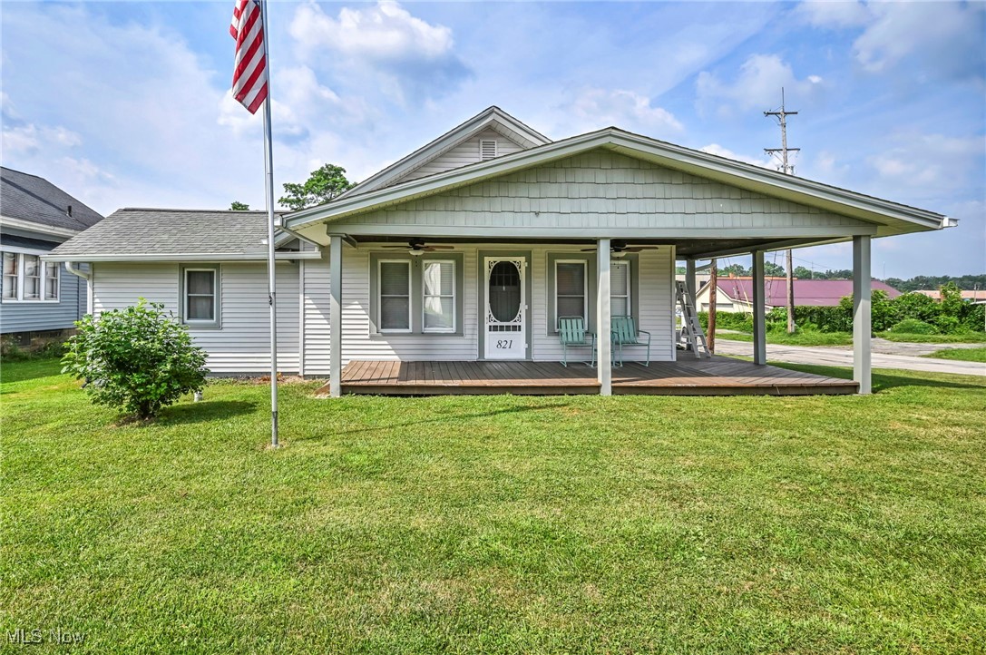 Welcome to this charming Ravenna home, nestled on a spacious corner lot with eye-catching curb appeal. Thoughtful exterior updates include a newer roof, refreshed siding, and a concrete driveway—complete with a basketball hoop for added fun. A two-car detached garage adds practicality, while the inviting front porch, featuring ceiling fans and lighting, offers the perfect spot to relax and unwind.
Step inside to find a sun-filled interior with generous natural light throughout. The main level boasts a large primary bedroom with two walk-in closets and direct access to a beautifully updated full bath with a walk-in shower. A versatile second bedroom or office, a convenient half bath, and a spacious dining room provide flexibility for daily living or entertaining. The first-floor laundry adds extra ease to your routine. Need more space? The walk-up attic offers excellent potential for additional storage or future finishing. Downstairs, the basement features two additional rooms ideal for storage, a workshop, or creative flex space—plus walk-out access leading to the backyard. Outdoors, enjoy a fully usable and expansive backyard complete with a fire pit and a one-of-a-kind bench from historic Geauga Lake. A shed provides extra storage for tools, lawn equipment, or seasonal items. Located just minutes from the Ohio Turnpike, downtown Ravenna, and Streetsboro, this property combines comfort, space, and convenience in one inviting package. Don’t miss your opportunity—schedule your private showing today!