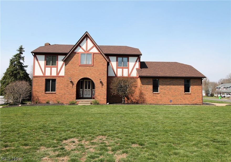 Luxurious in every detail! Welcome to this stunning four bedroom, two full and half bath Tudor home. Come on in through the front door to the large foyer which was recently painted, living room, dining room, and kitchen. The fabulous large eat in kitchen which was recently painted has Cambria Quartz counters (2018), abundant of cabinets, new sink and faucet (2018), new garbage disposal (2018), new sliders with built in blinds (2019) which open to the huge deck for enjoying the view to the wide open large beautiful backyard. Kitchen is open to the family room which has a wood burning fireplace that is currently used for gas, so much room for entertaining, and large windows to let the natural light to shine through. The laundry room offering the washer (2017), dryer, and the half bath finishes the main level. The upstairs hall was recently painted, and the upstairs bath has granite counter, redone floors. There are four large bedrooms, the master suite has a full bathroom and walk in clo