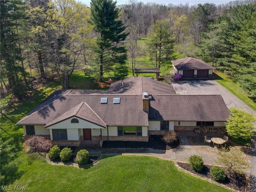 Nestled on 1.81 acres in Bentleyville,this mid century ranch has been updated and well maintained.  Updated eat in kitchen with granite, stainless appliances and Kraftmaid cabinets as well as a large island with seating and a walk in pantry.  The large family room boasts beautiful views of the back yard.  You'll love the vaulted ceilings and the transom windows as well. The Living room features a front entry foyer as well as beautiful built ins, a gas fireplace and a large picture window. There is plenty of natural light in the dining room which is adorned with sky lights and a vaulted ceiling.  The east wing of the home is where 3 of the 4 bedrooms are located including the Master suite.  Here you'll find a walk in closet and an updated bath with a double vanity and a zero entry shower.  The additional bedroom is located on the opposite side of the home and would make an ideal guest suite. There is a remodeled bath also with a zero entry shower just steps away. Just out the back door