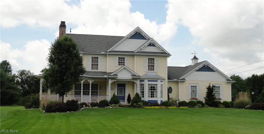 Enchanting Victorian style home in the Queen Anne vernacular, custom built in 2003 by Pelton Design & Construction, with a fabulous 367 sq. ft. Covered Wrap Around Front/Side Porch on 2.5 Acres in York Township, Medina County, Ohio! The home features 2,205 sq. ft. of quality living space with Hardwood Flooring throughout the first floor; an additional 1,095 sq. ft. is available in the lower level of the house. Eat-in Country Kitchen has Hickory Cabinets, Island, Stainless Steel Appliances, Double Pantry and Dining Alcove. The Great Room/Family Room is appointed with a Stone Façade Gas Fireplace & Hardwood Flooring expanding outdoors to a private Rear Deck. Pillared Formal Dining Room with Hardwood Flooring and Crown Molding could double as an Office/Den. Spacious Owner's Suite includes a unique 83 sq. ft. Sitting Room Alcove Extension, Glamour Bath w/Jacuzzi Tub, Soapstone Countertops and Walk-in Closet. Custom Disney-themed accents adorn the additional bedrooms & bathroom. The lower l