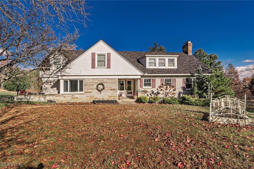 WOW!! Check out the NEW PHOTOS of neutralized rooms. First floor master with large closet and new ensuite. New roof and updated electrical in August 2025. Documents will transfer to new owner. Welcome to this stunning, custom-built home featuring timeless craftsmanship and thoughtful updates throughout. Come inside to a beautiful hand-built oak staircase accented with bronze and aluminum railings. Brand new floor-to-ceiling windows and new double doors flood the main level with natural light and lead you to the spacious backyard. The Amish-built kitchen boasts custom ivory cabinetry, granite countertops, abundant storage, a newer six-burner gas cooktop with exhaust fan, stainless steel in-wall oven, and refrigerator — perfect for the home chef. The main level showcases beautifully refinished hardwood floors, as well as an office with built-in shelving and cabinetry. Downstairs, the walk-out basement offers a cozy fireplace with marble and mahogany finishes, luxury vinyl plank flooring, a real tin ceiling and a full bathroom — perfect for additional living or entertaining space. Upstairs, you’ll find four spacious bedrooms, attic storage access, and two full bathrooms, all with gleaming hardwood floors. Enjoy winter views of downtown Cleveland and Lake Erie from the backyard. A new Architectural asphalt shingle roof is being added within the next few weeks.  Electrical updates are being completed by a licensed electrician. A certificate of  safety with a five year warranty will be provided. Additional highlights include an attached heated two-car garage and original architectural drawings that speak to the home’s quality and charm. Conveniently located  near Brecksville City Center, pools, rec center, golf courses, the Metroparks, and with easy access to I-480, I-77, and the Turnpike — this exceptionally well-built home truly has it all. The owner is a licensed real estate agent and only the second owner.