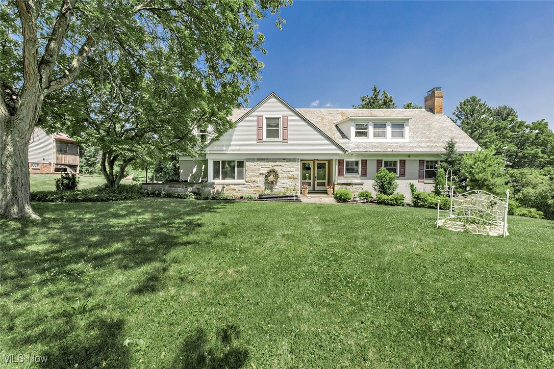 Welcome to this stunning, custom-built home featuring timeless craftsmanship and thoughtful updates throughout. Come inside to a beautiful hand-built oak staircase accented with bronze and aluminum railings. Brand new floor-to-ceiling windows and new double doors flood the main level with natural light and lead you to the spacious backyard. The Amish-built kitchen boasts custom ivory cabinetry, granite countertops, abundant storage, a newer six-burner gas cooktop with exhaust fan, stainless steel in-wall oven, and refrigerator — perfect for the home chef. The main level showcases beautifully refinished hardwood floors, as well as an office with built-in shelving and cabinetry. Downstairs, the walk-out basement offers a cozy fireplace with marble and mahogany finishes, luxury vinyl plank flooring, a real tin ceiling and a full bathroom — perfect for additional living or entertaining space. Upstairs, you’ll find four spacious bedrooms, attic storage access, and two full bathrooms, all with gleaming hardwood floors. Enjoy winter views of downtown Cleveland and Lake Erie from the backyard. A new Architectural asphalt shingle roof is being added within the next few weeks. Electrical updates are being completed by a licensed electrician. A certificate of safety with a five year warranty will be provided. Additional highlights include an attached heated two-car garage and original architectural drawings that speak to the home’s quality and charm. Conveniently located near Brecksville City Center, pools, rec center, golf courses, the Metroparks, and with easy access to I-480, I-77, and the Turnpike — this exceptionally well-built home truly has it all. The owner is a licensed real estate agent and only the second owner.