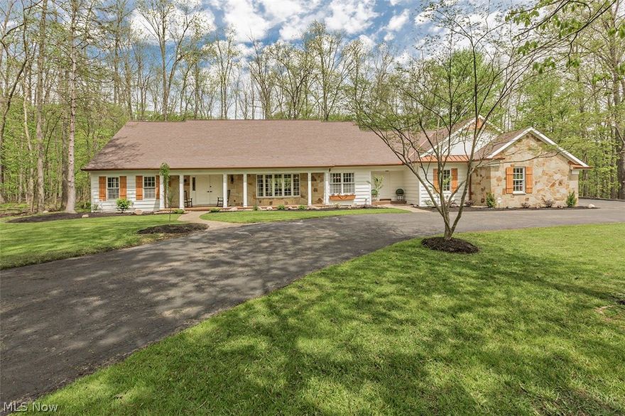 Situated in one of the most desirable neighborhoods in Gates Mills, this stunning 4 bedroom Cape Cod has been completely renovated top to bottom and is situated on a gorgeous 2.5 acre wooded lot! Enter through a large open foyer with plenty of light into an amazing open floor plan. Large formal living room & formal dining room all open to family room w/ stone fireplace that opens to brand new deck. A true chef's kitchen featuring upscale appliances, center island, loads of cabinetry and quartz countertops w/ tile backsplash. First floor also offers an office w/ built ins, laundry room, and a half bath. Convenient first floor master bedroom with huge picture window overlooing backyard and an incredible master marble bathroom opening to custom designed closet. The second floor offers 3 large bedrooms w/ walk in closets and 2 full baths. Wait until you see the lower level!!! Fit for entertaining, this fantastic basment has a second kitchen, full bath, theatre room, bar and options for wor